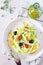 Raw foodism: uncooked spaghetti zucchini, cherry tomatoes, olives