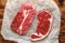 Raw fresh braising and sirloin beef steak butcher`s cut ready to cook