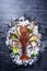 Raw fresh Cape rock lobster, West Coast rock lobster, Jasus lalandii on a dark slate background with cold ice cubes, top view,