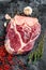 Raw fresh cross cut beef shank, leg. Black background. Top view