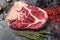 Raw fresh cross cut beef shank, leg. Black background. Top view