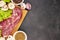 Raw fresh marble meat steak and seasonings on a dark marble background, top view