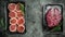 Raw fresh marbled meat Steak filet mignon. medallion steaks wrapped in bacon on dark concrete background. Meat products in packed