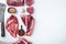 Raw fresh marbled meat Steak, seasonings, tomahawk, t bone, club steak, rib eye and tenderloin cuts, on white stone  background,