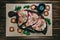 Raw fresh meat pork steak and seasonings on a dark wooden background board honey tomato board