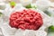 Raw fresh minced meat on kitchen table