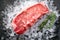 Raw fresh New York beef steak on ice