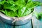 Raw fresh organic spinach in a bowl closeup