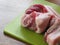 Raw Fresh Streaky Pork On Green Cutting Board