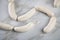 Raw German Bavarian WeiÃŸwurst white sausage chain on marble background