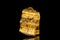 Raw golden tiger eye mineral stone in front of black background