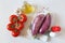 Raw graffiti eggplants, garlic, tomatoes on light background