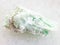 raw green talc stone on white marble