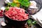 Raw ground beef meat with ingredients for cooking. Fresh minced meat