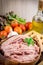 Raw ground meat in wood bowl.