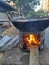 Raw groundnuts and  peanuts are heated and sold in winter in Mumbai India with wood fire in big pan with seashore sand