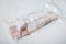 Raw haddock fish skinless, plastic vacuum packaged, on white background