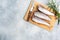 Raw hake fish carcass on a wooden chopping Board. top view Copy space