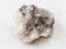 raw Halite (rock salt) stone on white marble