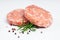 Raw Hamburger,meatballs on white background. fast food at home.Convenience food, precooked.Raw chicken burger on a white plate in