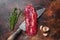 Raw Hanging Tender steak on a butcher knife . Dark background. Top view