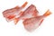 Raw headless gutted carcasses of redfish on a white background