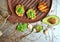 Raw , healthy food with avocado and basil pesto with garlic