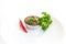 Raw homemade Argentinian green Chimichurri salsa or sauce isolated on a white background