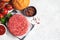 Raw ingredients for burgers, white background, copy space. Cooking background