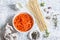 Raw ingredients for cooking pumpkin noodles spaghetti. On a light background