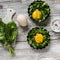 Raw ingredients for making baked eggs. Fresh sorrel and eggs