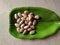 Raw jackfruit seeds in a plate.