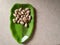 Raw jackfruit seeds in a plate.