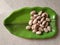 Raw jackfruit seeds in a plate.