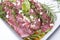 Raw lamb fillets with mediteranean herbs