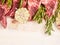 Raw lamb meat with garlic and rosemary on white wooden backgound, top view