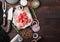 Raw lean diced casserole beef pork steak with vintage meat hatchet and knife and fork on wooden background. Salt and pepper with