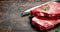 Raw marbled beef steaks with rosemary