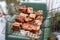 Raw marinaded juicy pork meat in grill grates