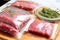 raw marinated meat separated in ziplock bags