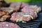 Raw meat on barbecue wire, barbecue preparation