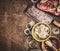 Raw meat with Butcher Cleaver and ingredients for meat grilling on rustic wooden background