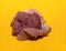 Raw meat cut into small portions preparation for frying on a light background yellow base shades