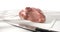 raw meat on a cutting board with a knife. piece of fresh pork. farm product on a white background.