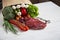 Raw meat, different vegetables and fruits on white wooden table.