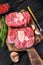 Raw meat osso buco veal shank steak , making italian ossobuco. Black Wooden background. Top view