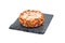Raw meat patty with spices on slate board, single pork cutlet isolated on white