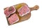 Raw meat paupiettes, rosemary and red peppercorn on wooden bord and white background