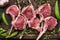 Raw meat rack of lamb and green pea on dark wooden background, top view