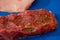 Raw meat seasoned ready-to-cook extreme close-up background, real food preparing before cooking in kitchen. Fresh rump beef steak
